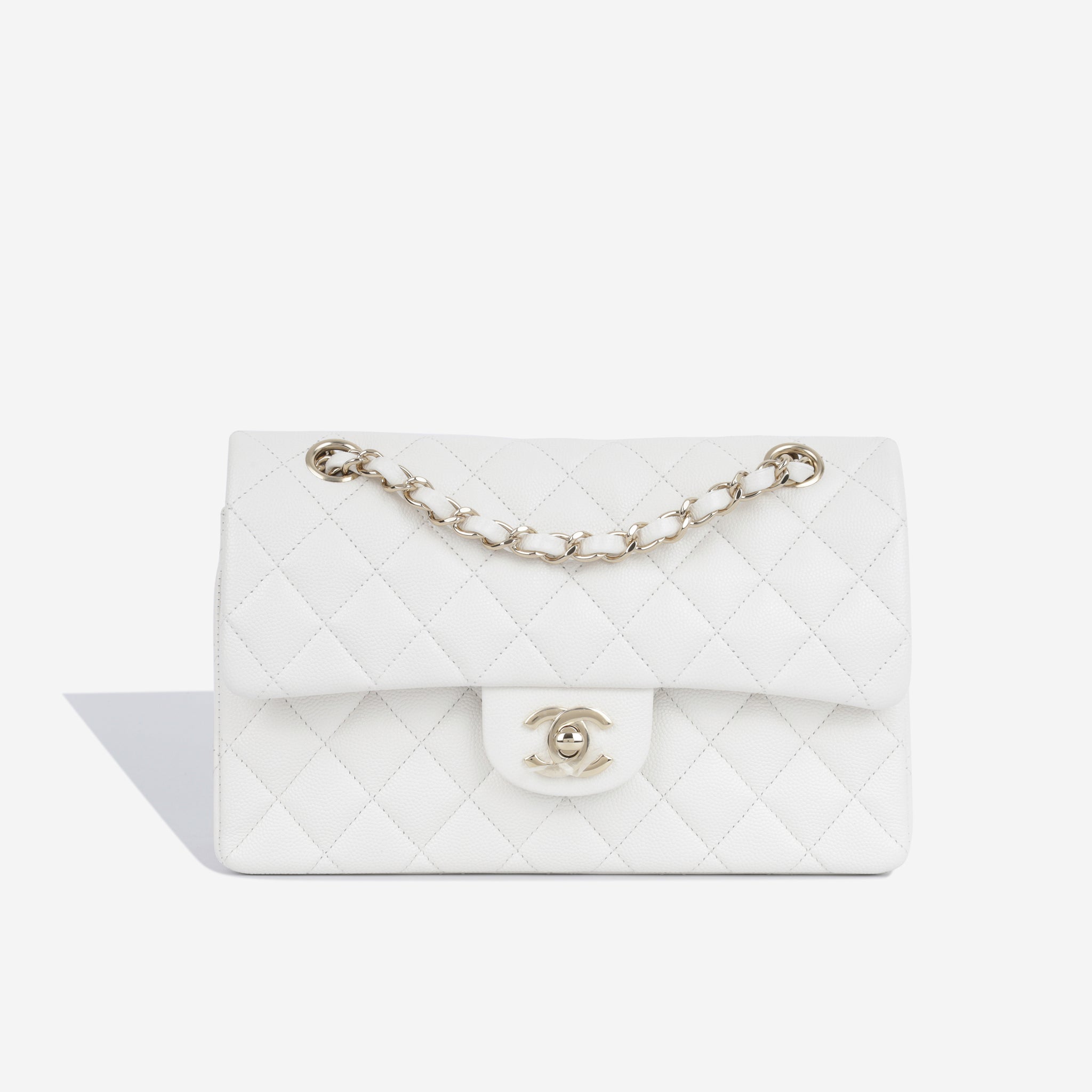 Chanel Small Classic Flap Bag in White Lambskin with golden hardware |  Chanel small classic, Classic flap bag, Chanel bag classic