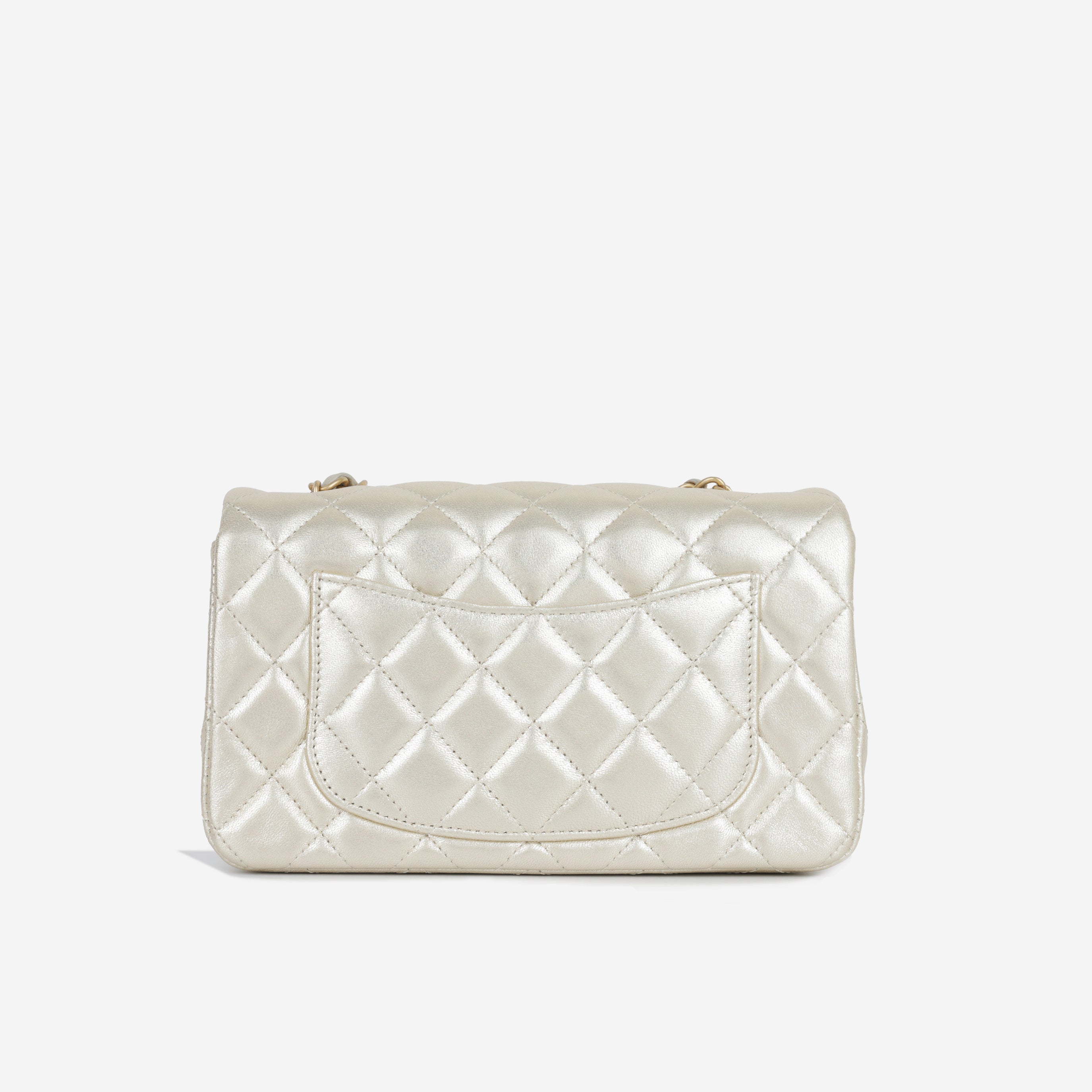 Chanel Classic Mini Flap - Metallic Champagne Lambskin GHW – Bagista