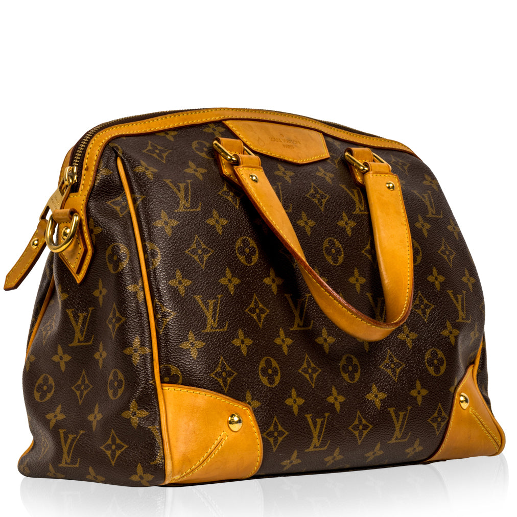 Louis Vuitton monogrammed bowling vanity canvas handbag with leather trim  and handles photographed on a white background Stock Photo - Alamy